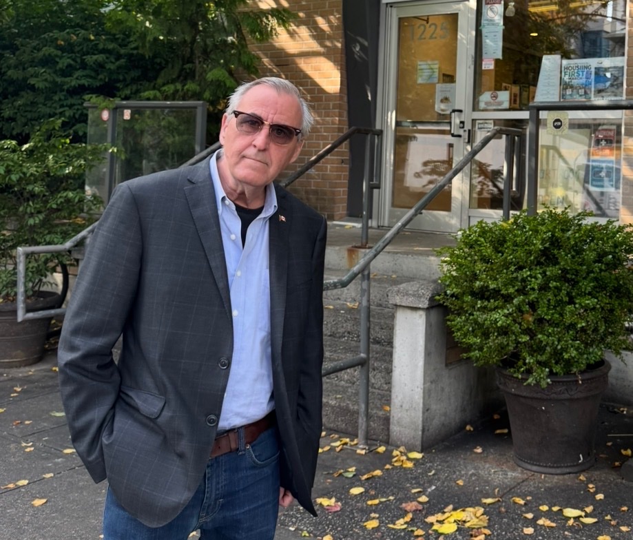 John standing outside a resource centre