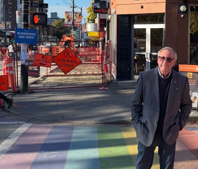 John standing in front of a road closure on Davie.